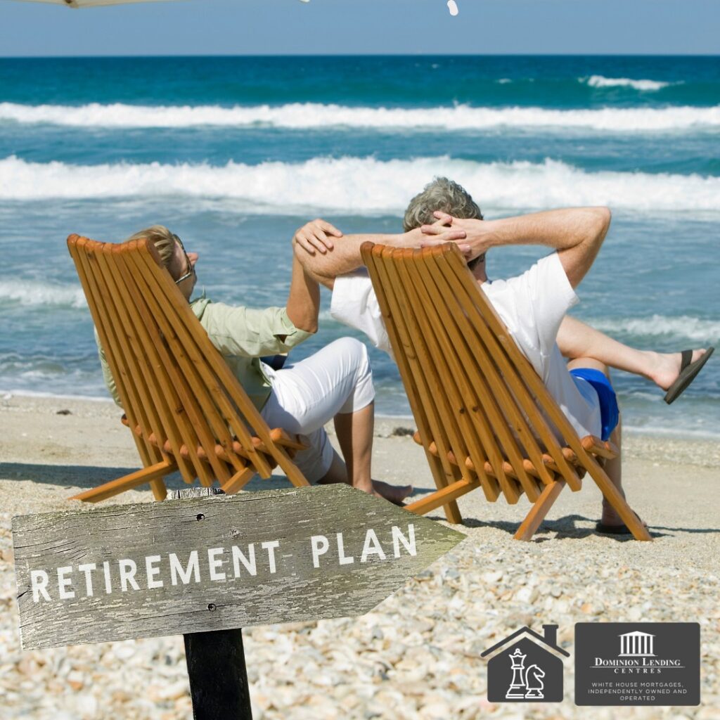 Couple reviewing retirement and home equity plans at a kitchen table in Salmon Arm, discussing HELOC options.