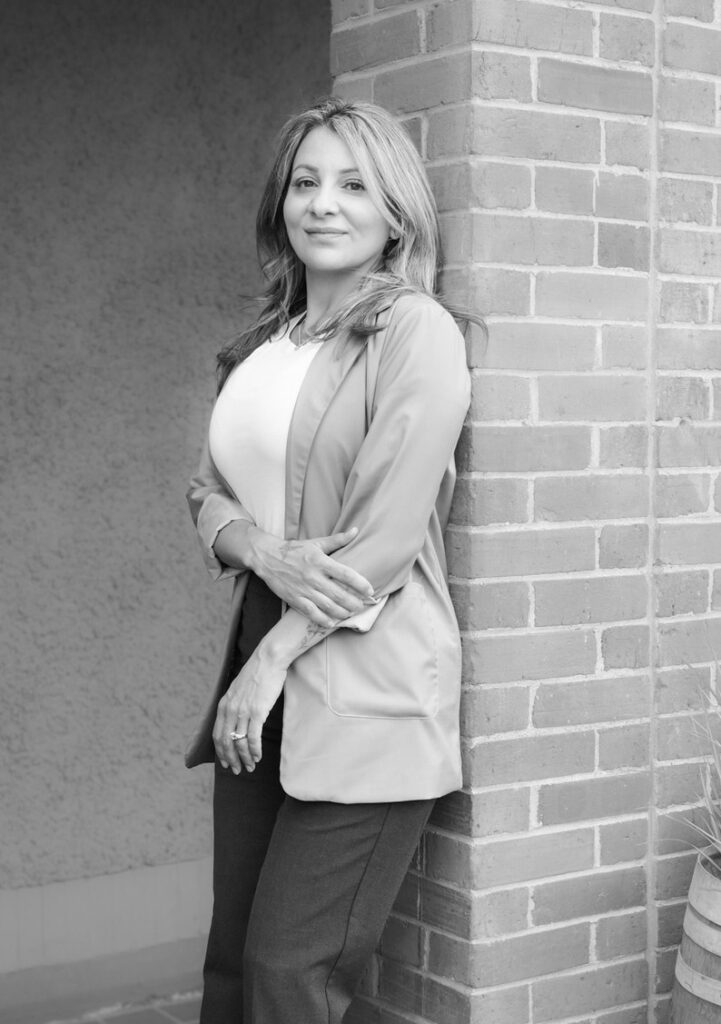 A homeowner in Salmon Arm reviewing mortgage renewal documents and planning for potential payment increases.